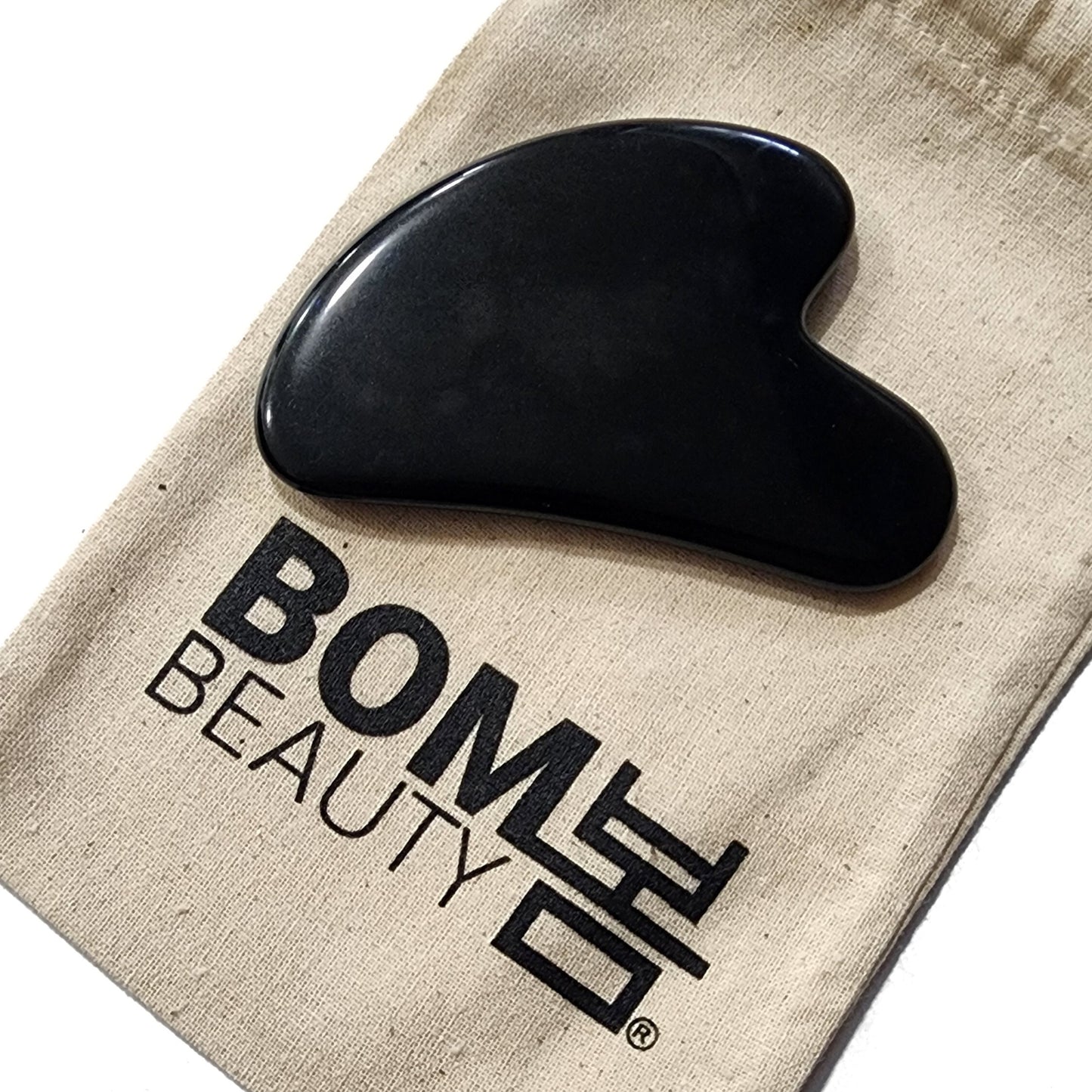 Piedra Facial Gua Sha Obsidiana Negra  en bolsa